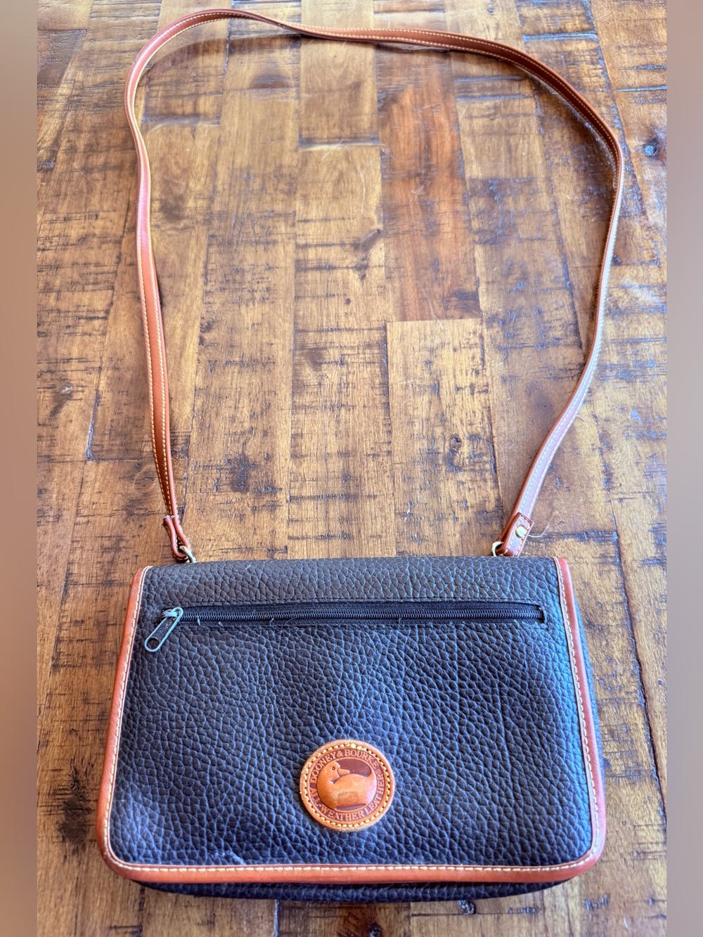 Dooney & Bourke Pebbled Leather Crossbody • Black/Tan • All‑Weather Logo